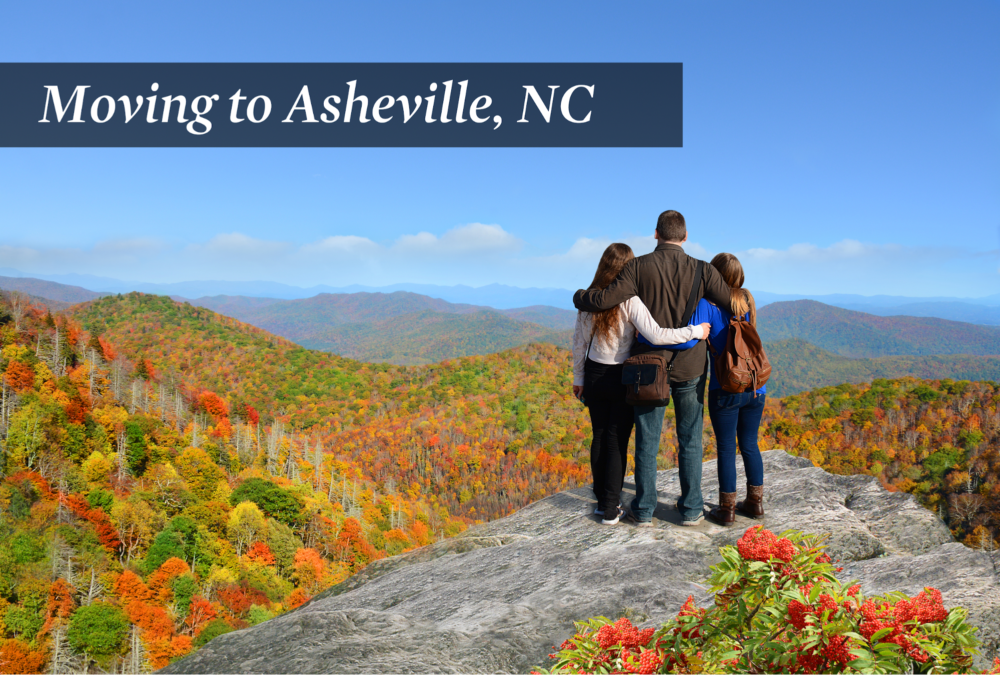 Three people standing on a cliff overlooking trees changing colors in the mountains during fall time.