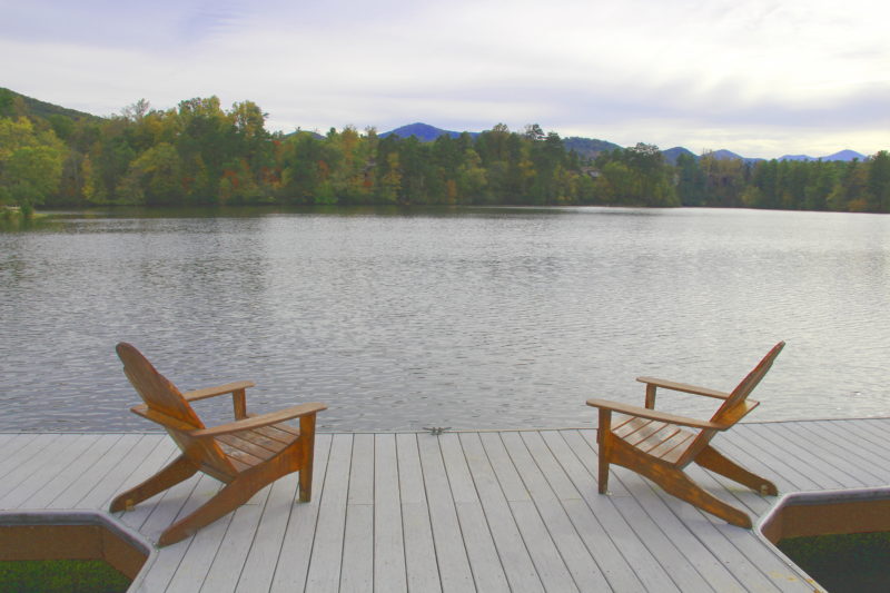 Lake dock with 2 adirondack chairs
