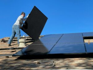 Person installing solar panels